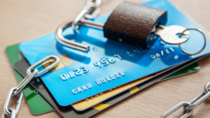 Credit cards with an open lock and chain. Open access to the use of electronic money image