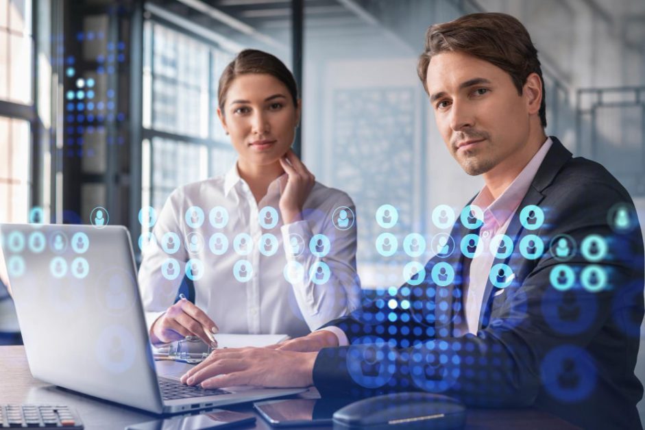 businessman-businesswoman-formal-wear-working-together-looking-new-employees-hire-international-business-consulting-hr-social-media-icons-modern-panoramic-office-background-min